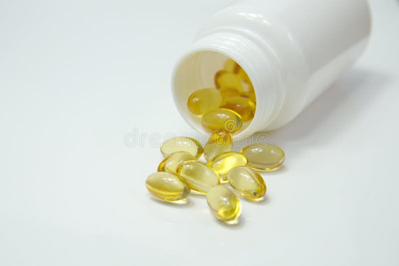 Yellow pills out of bottle stock image. Image of emotion 56638479