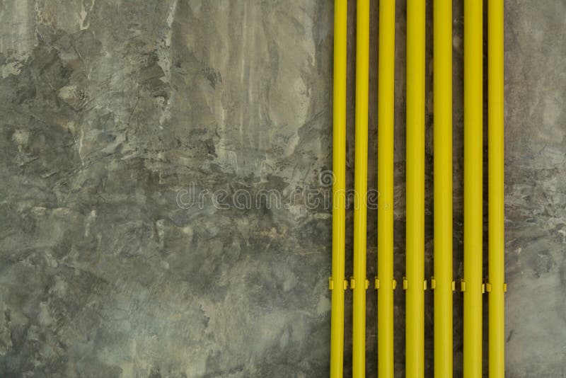 Yellow Pipe on Loft Grunge Wall Background stock images