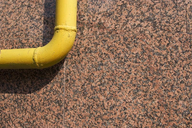Yellow pipe on marble background stock images