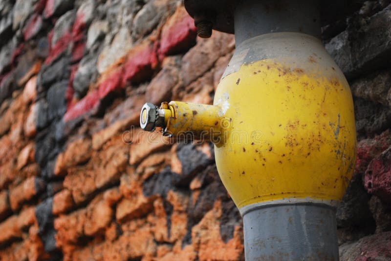 Yellow pipe near wall royalty free stock photo