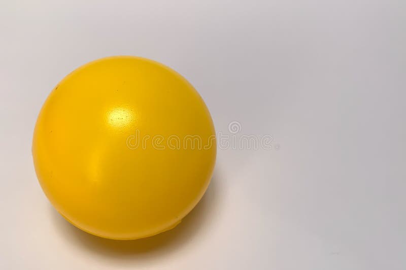 Yellow plastic ball stock image. Image of game, green 243213063