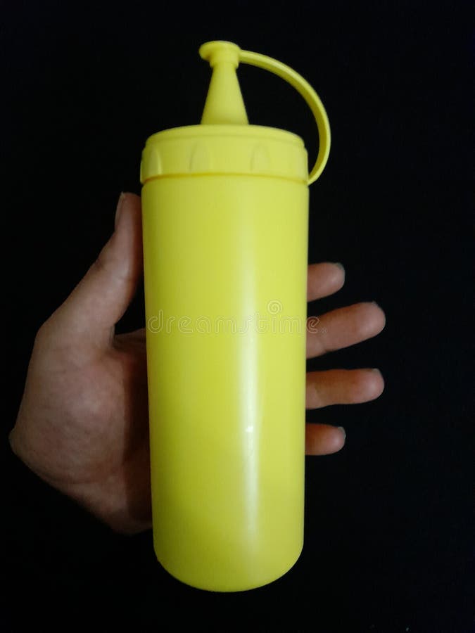 Yellow Plastic Bottle in Hand Stock Image Image of yellow, plastic