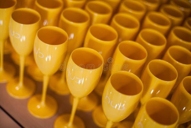 Yellow Plastic Wine Glasses on a Table Stock Photo Image of dishes, wine 137487874