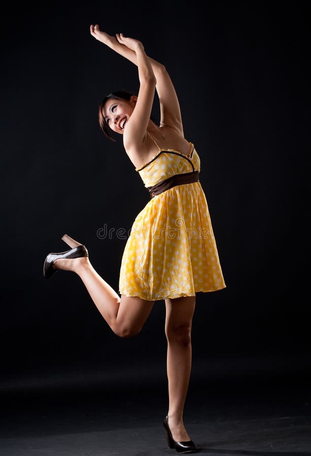 Yellow polka dot dancing girl