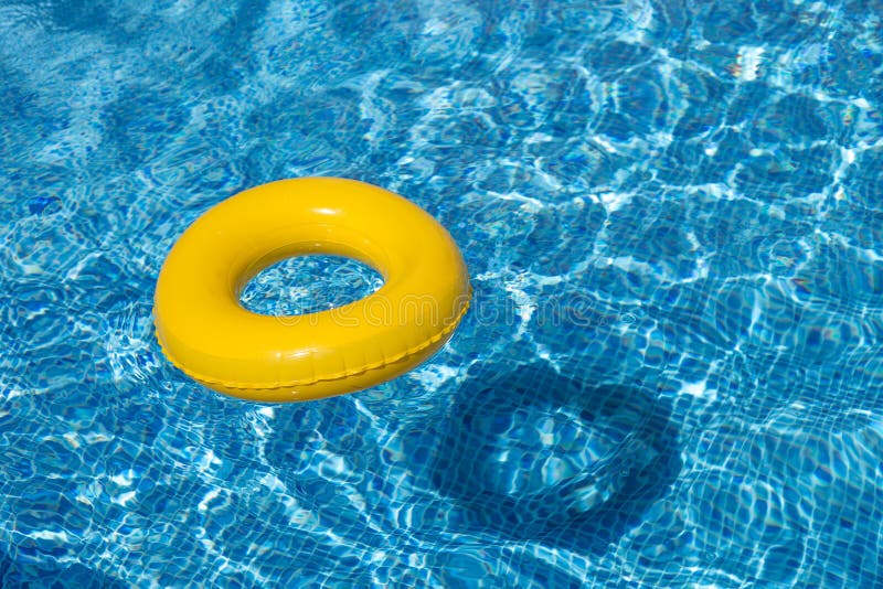 Yellow pool float, pool ring in cool blue refreshi royalty free stock photos Yellow pool float, pool ring in cool blue refreshi royalty free stock photos