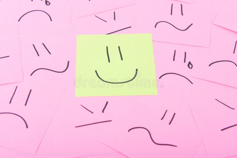 Yellow post it with happy face on red posits with sad faces