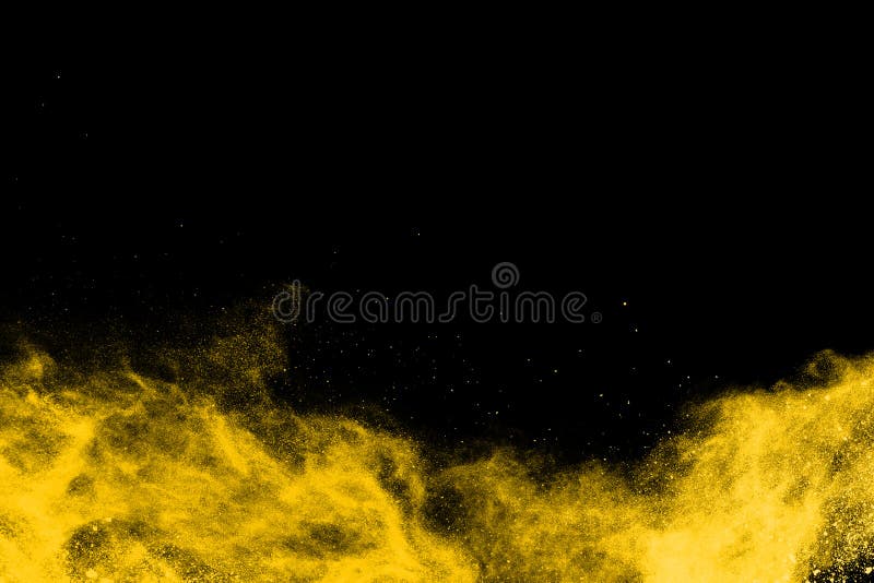 Yellow powder explosion on black background. royalty free stock images