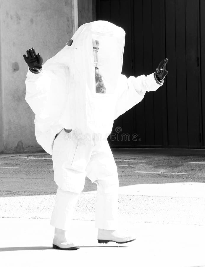 Person Yellow Protective Suit To Manage Hazardous Materials Stock