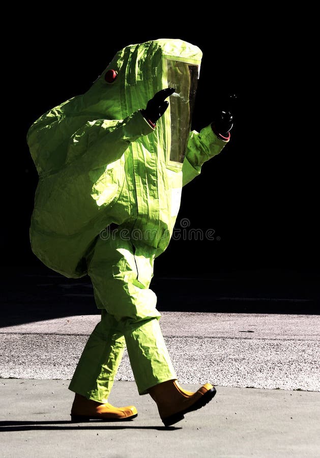 Person Yellow Protective Suit To Manage Hazardous Materials Stock