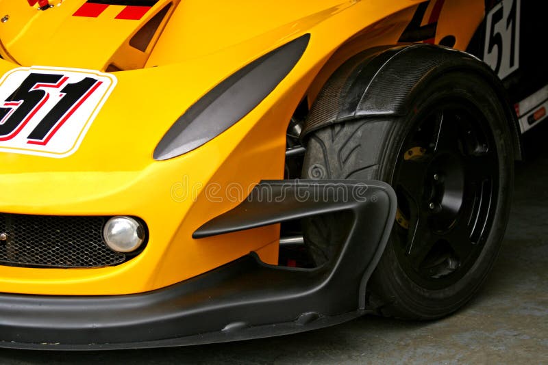 Yellow race car front tyre stock photo. Image of tire 5334166