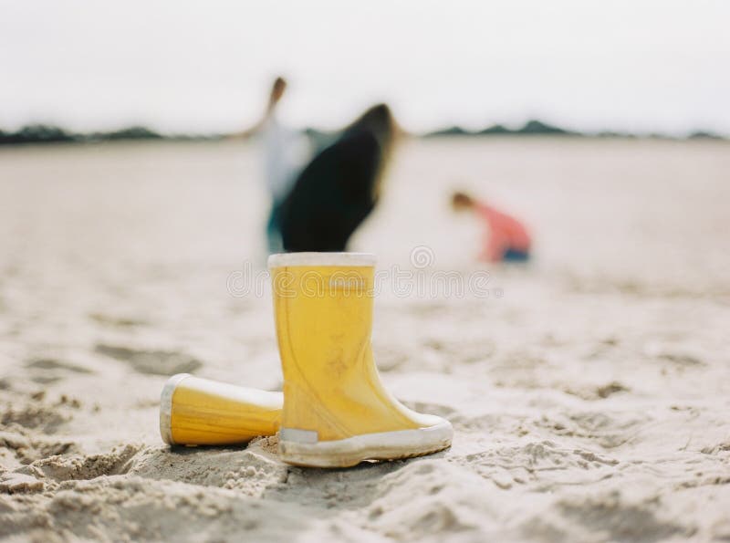 Yellow rain boots stock photo. Image of standing, boots 48615984
