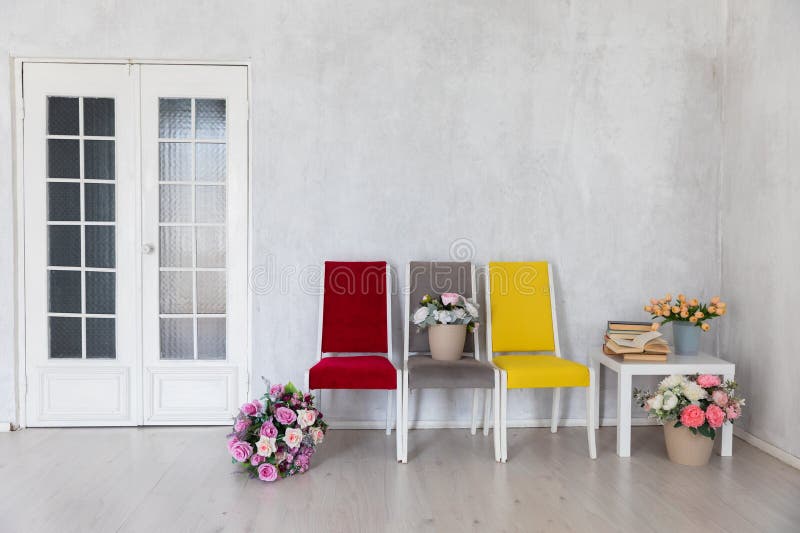 Yellow red grey chair with flowers on white background interior in bright room
