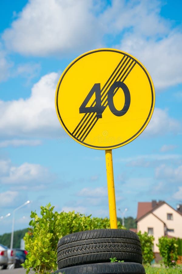 Yellow Road Sign Fixed on Tires Near the Road Stock Image Image of