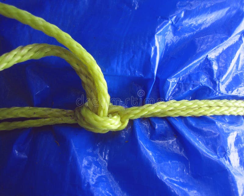 Yellow rope on blue tarpaulin