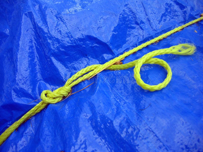 Yellow rope on blue tarpaulin