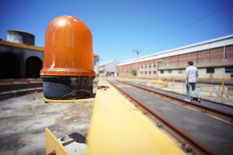 Yellow rotating indicator light for moving machines on the left side. royalty free stock images