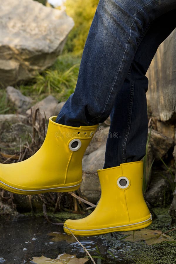 Yellow rubber boots stock image. Image of fall, design 65705645