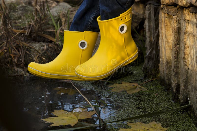 Yellow rubber boots stock photo. Image of bright, design 65705646