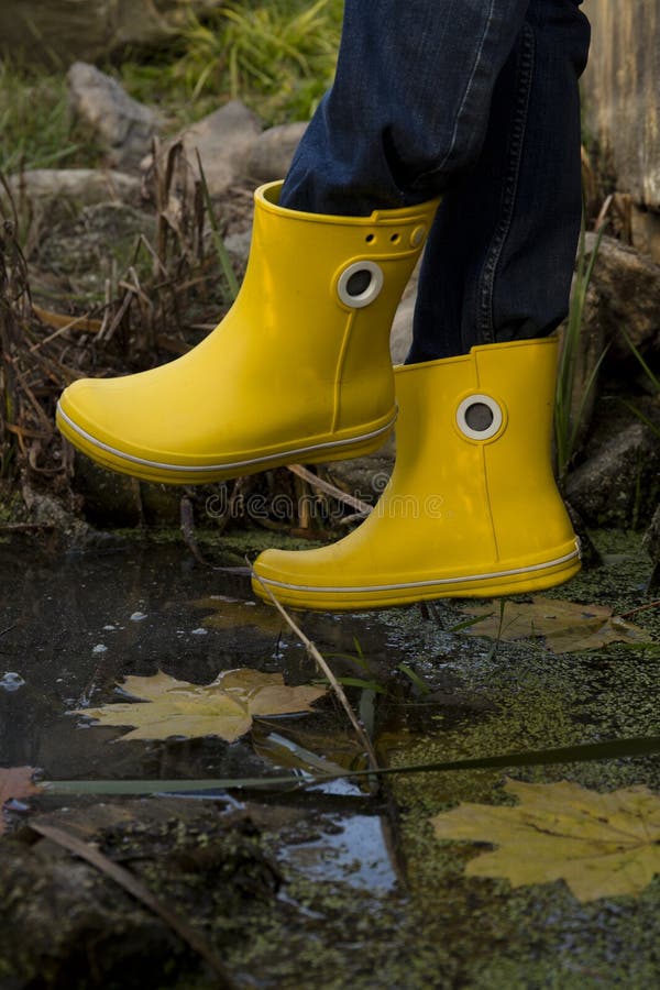 Yellow rubber boots stock photo. Image of colorful, brown 65705668