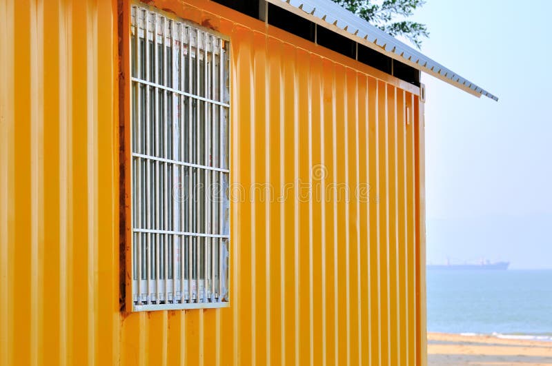 Yellow shed and sea view