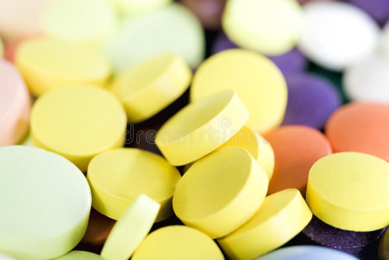 Yellow solid tablets stock photo. Image of modern, pink 223229518