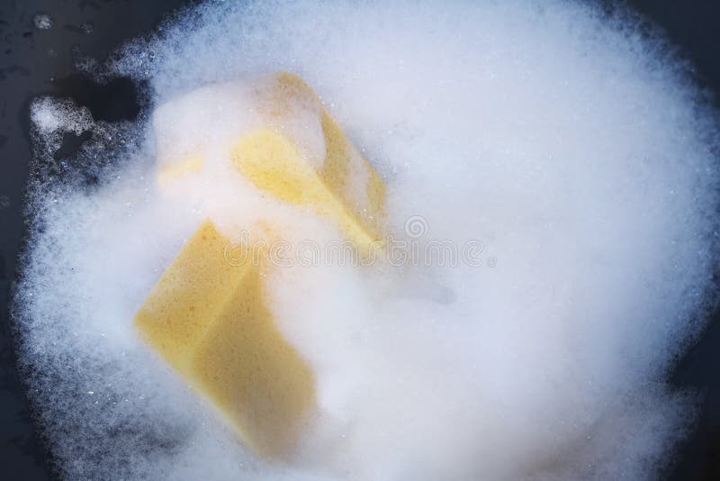 Yellow sponge in car wash and empty space for text royalty free stock photography Yellow sponge in car wash and empty space for text royalty free stock photography