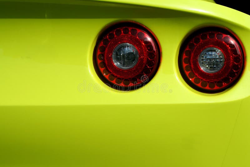 Yellow sports car red tail lights