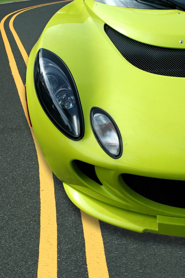 Yellow sports car on the road