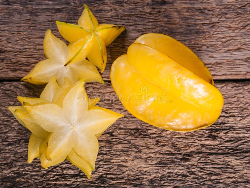 Yellow star fruit or star apple on wood background