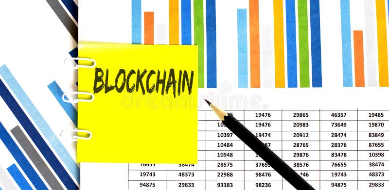 Yellow sticker with text BLOCKCHAIN on the chart with pencil . It can be used as a business and financial concept