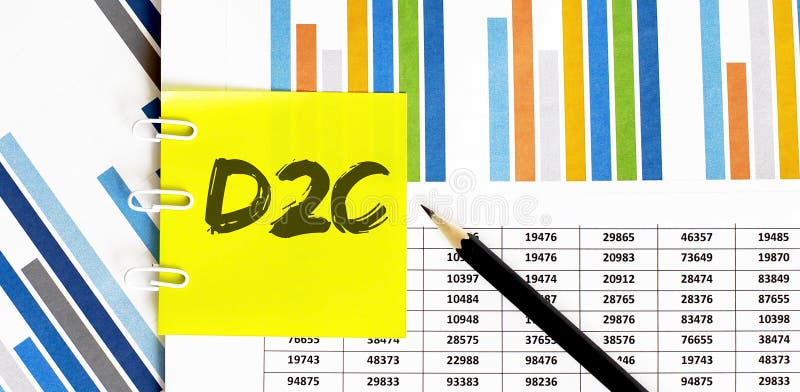 Yellow sticker with text D2C on the chart with pencil . It can be used as a business and financial concept