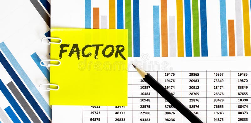 Yellow sticker with text FACTOR on the chart with pencil . It can be used as a business and financial concept