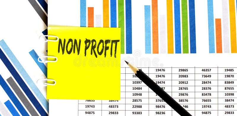 Yellow sticker with text NON PROFIT on the chart with pencil . It can be used as a business and financial concept