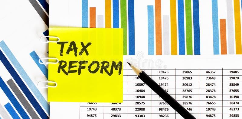 Yellow sticker with text TAX REFORM on the chart with pencil . It can be used as a business and financial concept