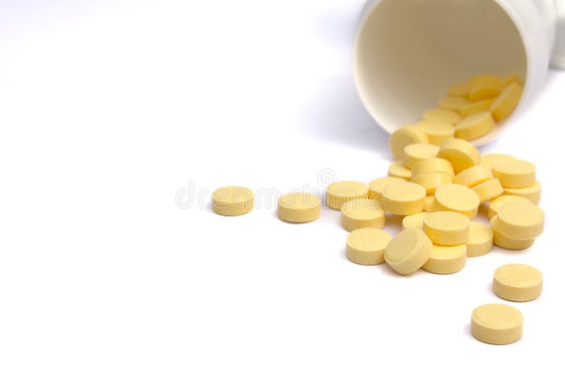 Yellow tablets with a jar