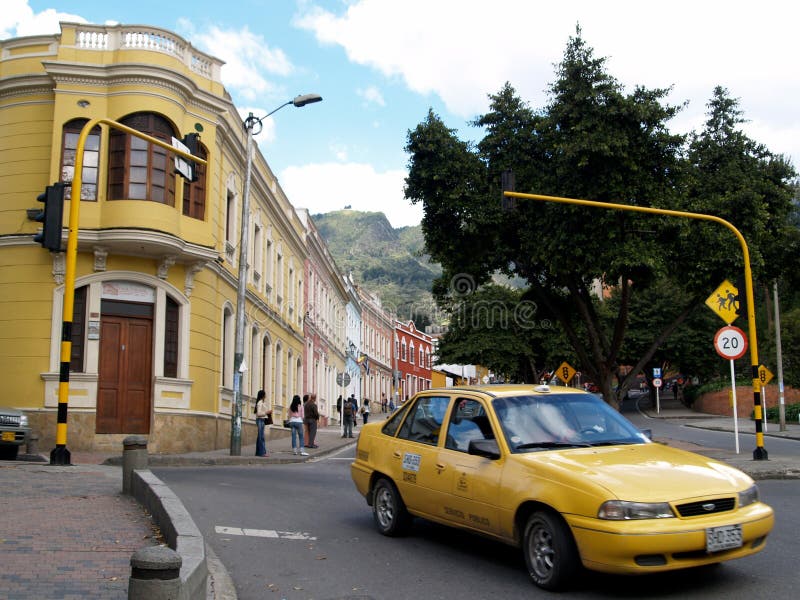 Yellow taxi and colonial buildings in Bogota, Colombia