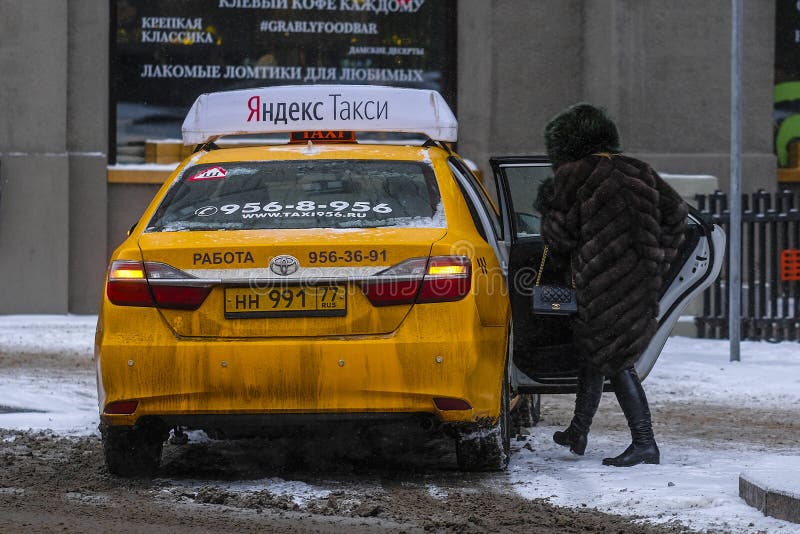 Yellow taxi in Moscow editorial stock image