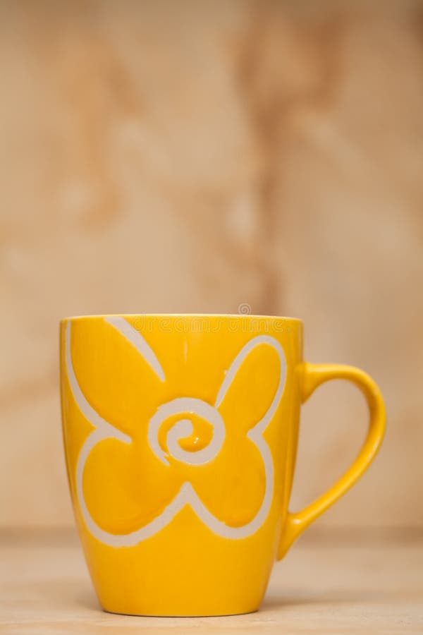 Yellow tea cup stock photo. Image of lighting, cosiness - 19580118