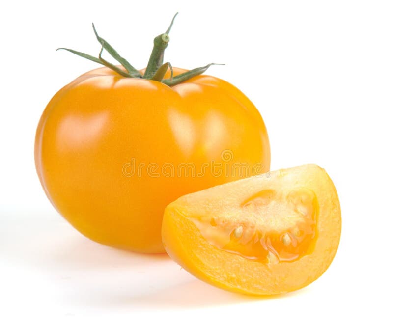 Yellow tomato with slices