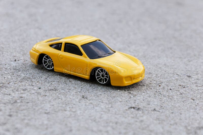 Yellow toy car stock photo. Image of road, asphalt, auto 54885432