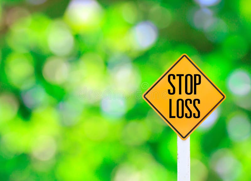Yellow traffic sign text for stop loss green bokeh abstract light background