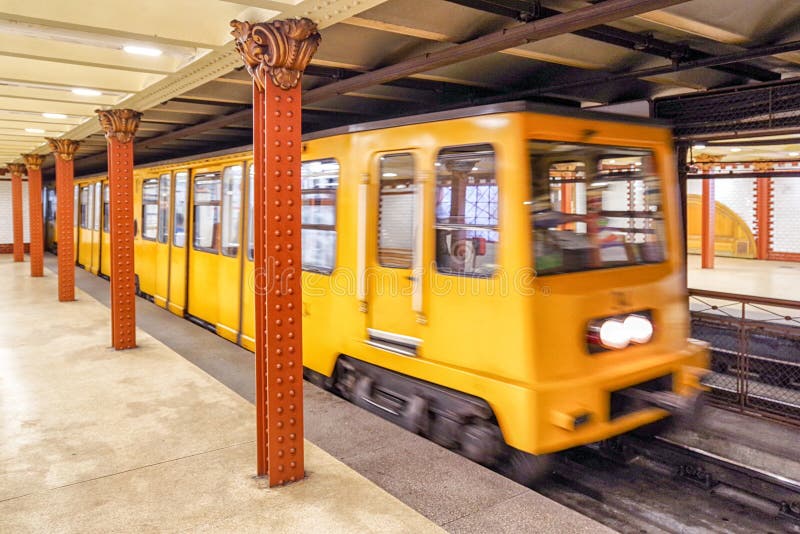 Yellow train coming on subway station, Budapest - Hungary