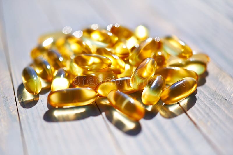 Yellow Translucent Pills with the Fish Oil Stock Image Image of pills