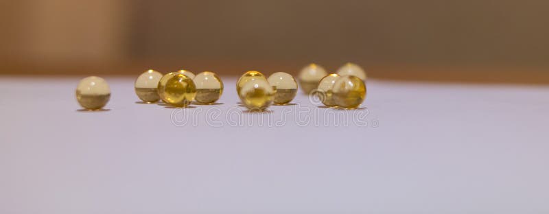 Yellow translucent round Golden balls. Fish ROE, oil stock photos