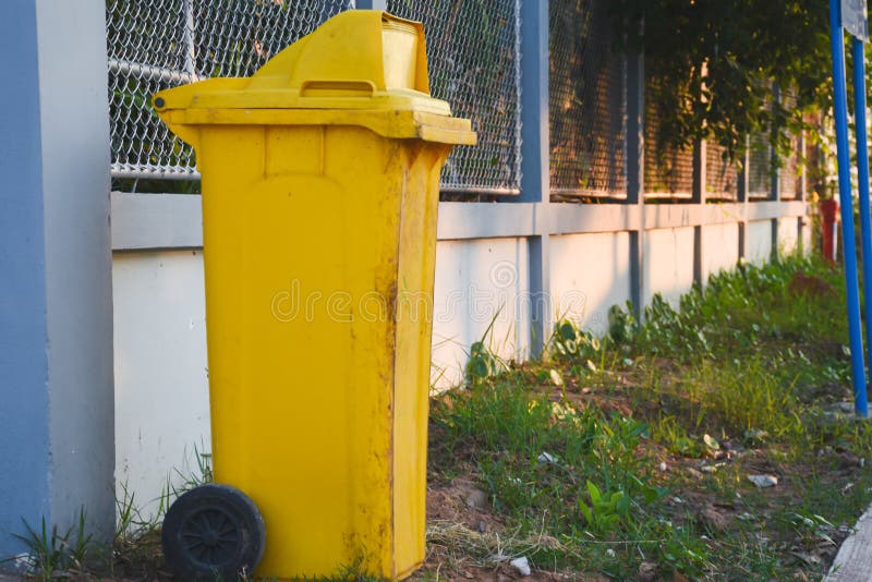 Yellow Trash Bin on the Floor Stock Photo Image of garbage, bins