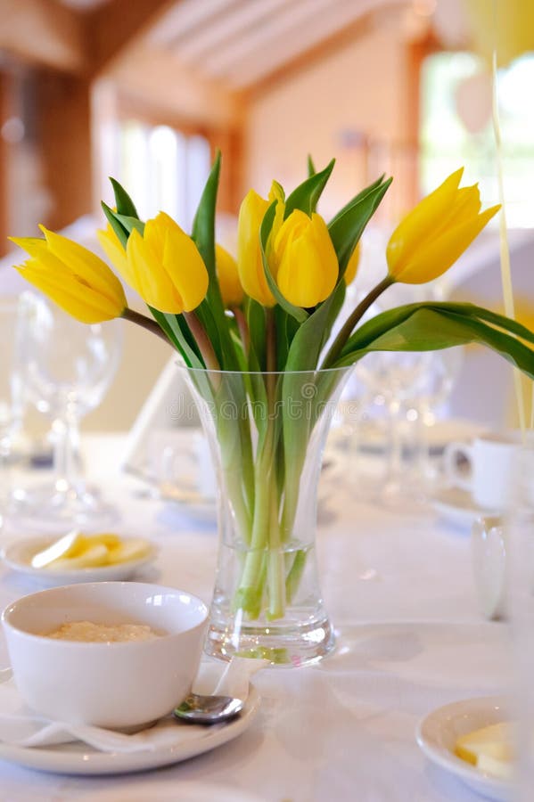Yellow tulips table decoration at wedding. Yellow tulips table decoration at wedding