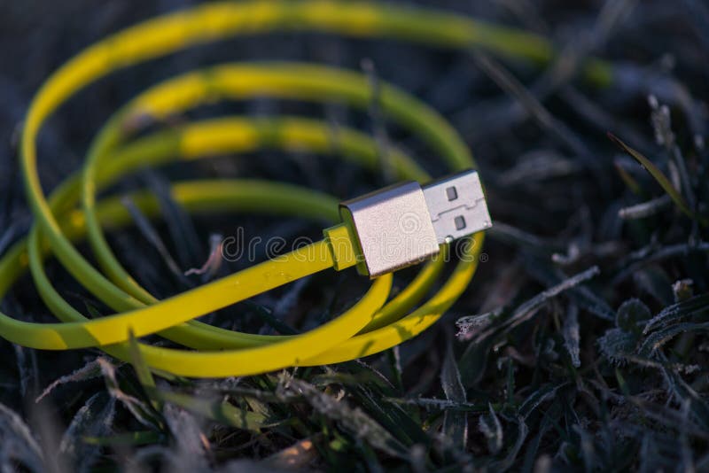 Yellow USB cable stock image. Image of grass, plastic 51817635