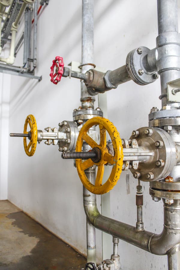 Yellow valve stock photo. Image of fabricator, pipe, faucet 979072