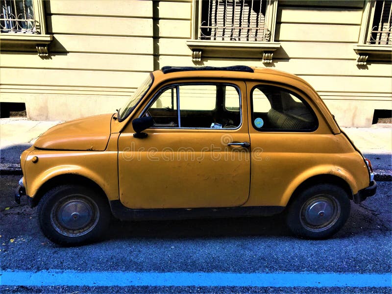 Yellow vintage Fiat 500 car. History, travel, fashion, colours and Italian style royalty free stock photo Yellow vintage Fiat 500 car. History, travel, fashion, colours and Italian style royalty free stock photo