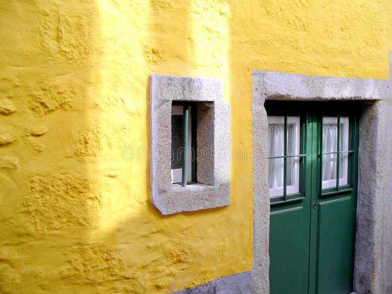 Yellow wall and green door